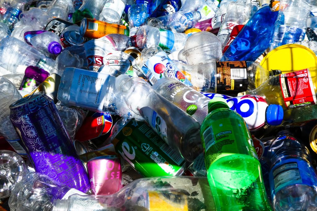 Plastic bottles and other recyclables in a pile.