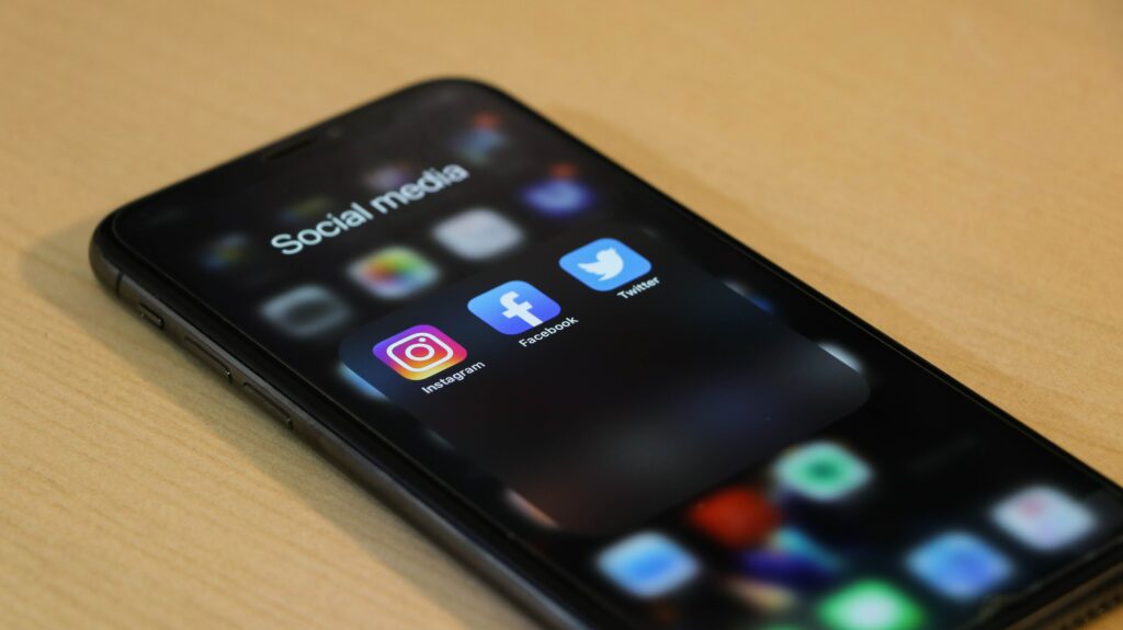 Phone displaying social media app icons