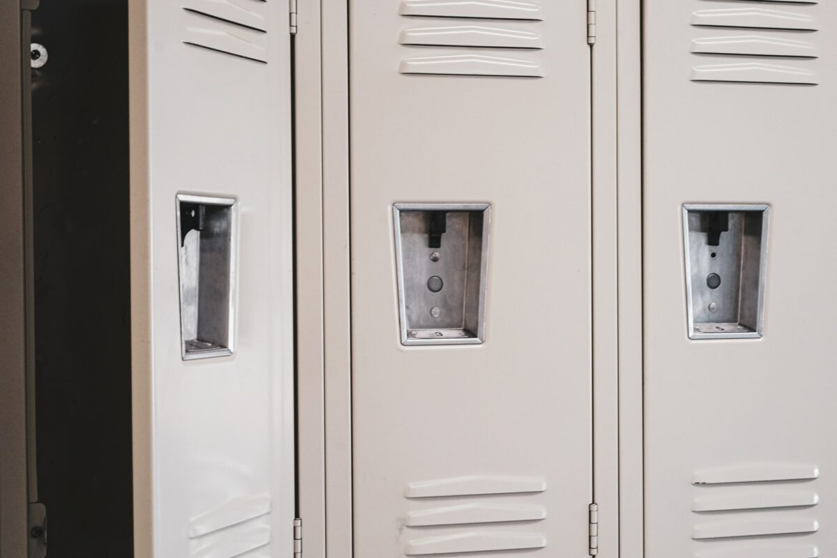 A line of lockers, the one on the left is open