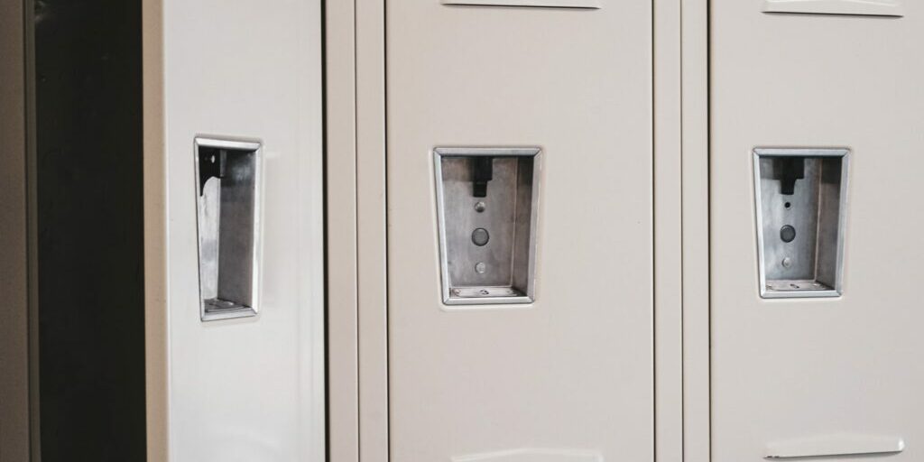 A line of lockers, the one on the left is open