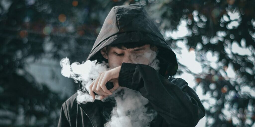 Young person using an e-cigarette