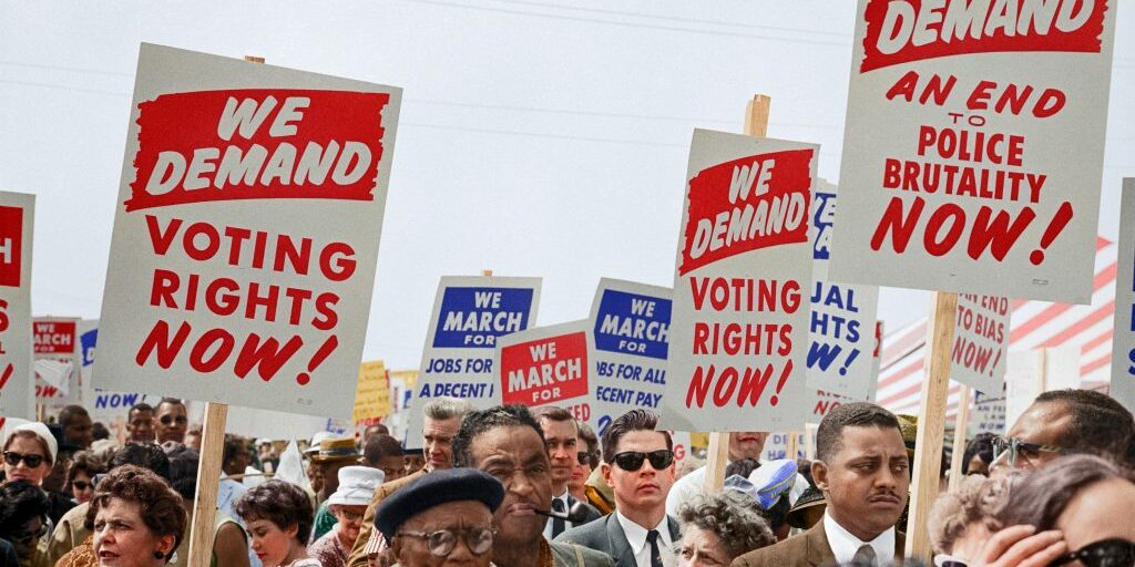 People marching with signs at the March on Washington, 1963